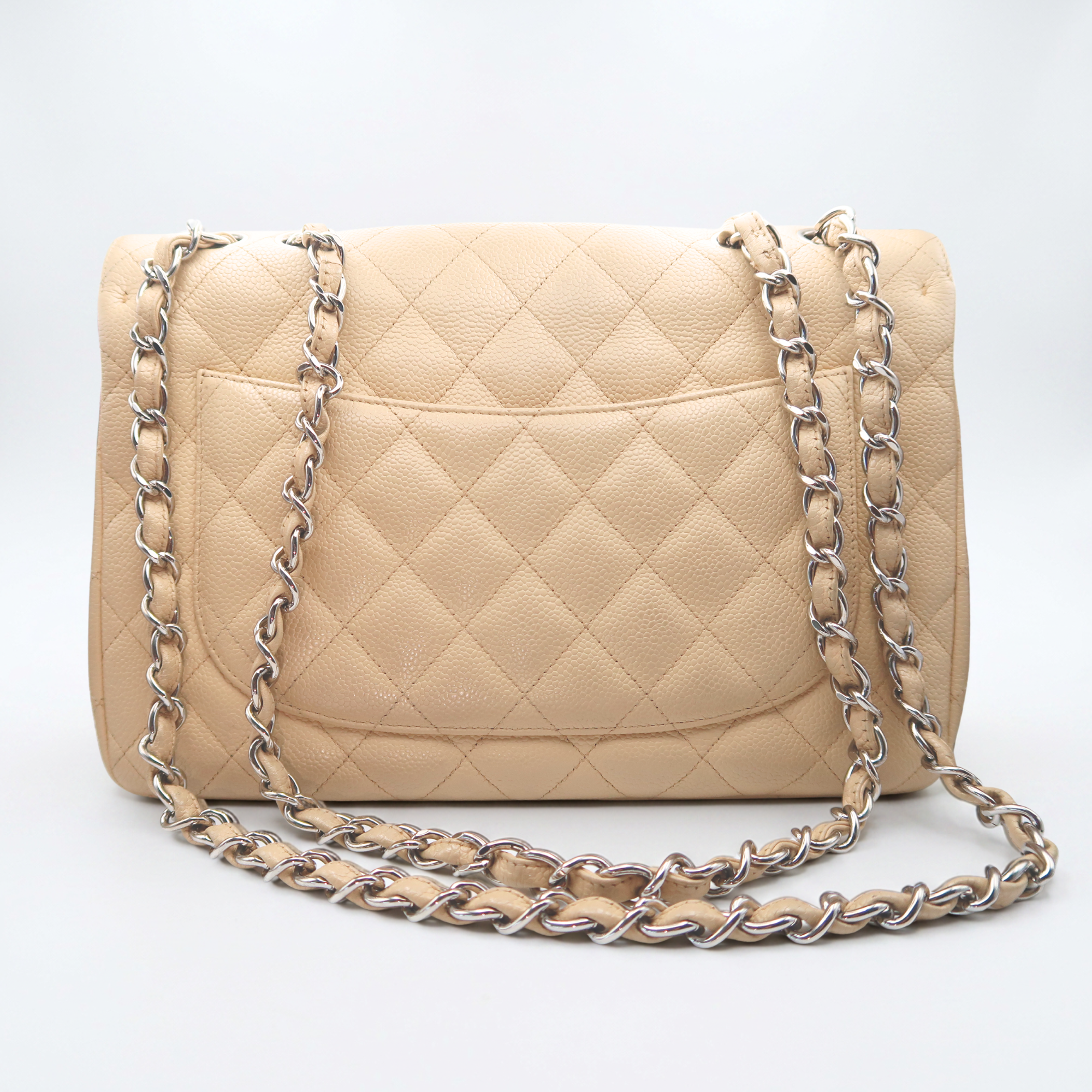 Back view of Chanel Classic Jumbo in beige caviar