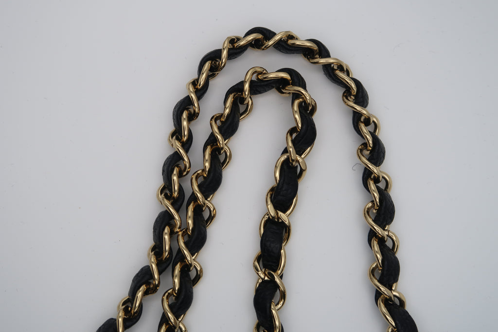 Straps on Chanel Classic Flap in black caviar