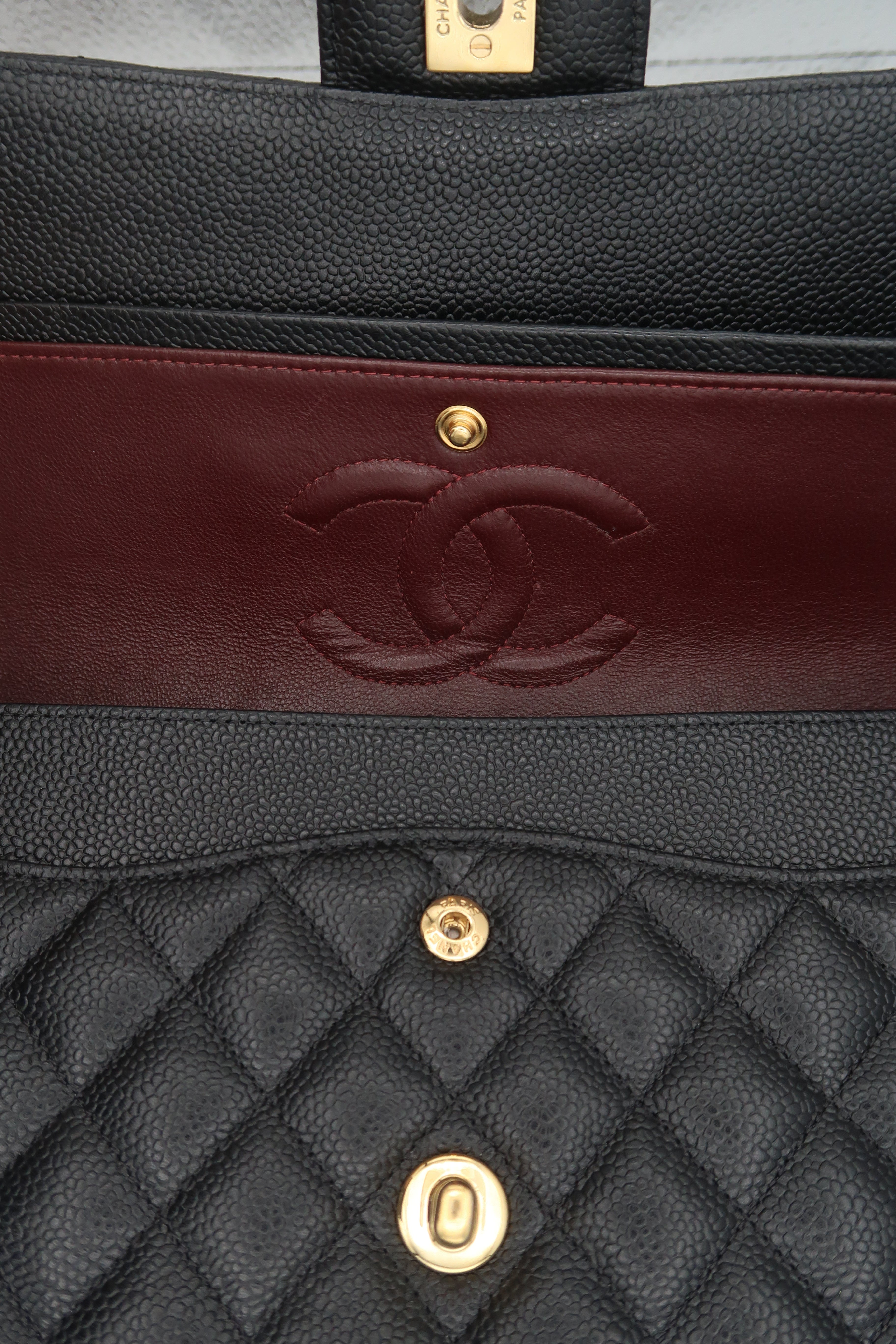 opened Chanel Classic Flap in black caviar