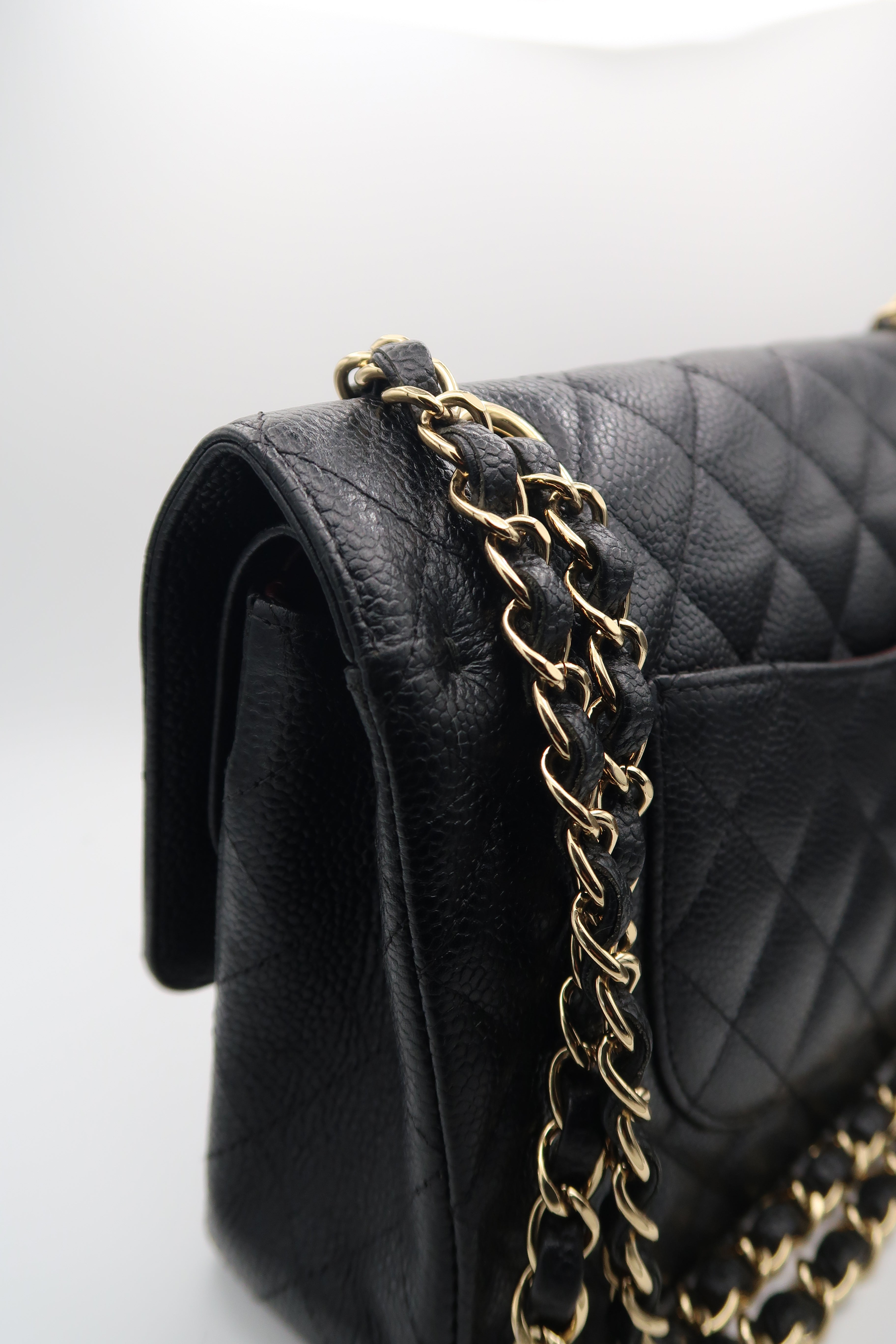 left side view of Chanel Classic Flap in black caviar