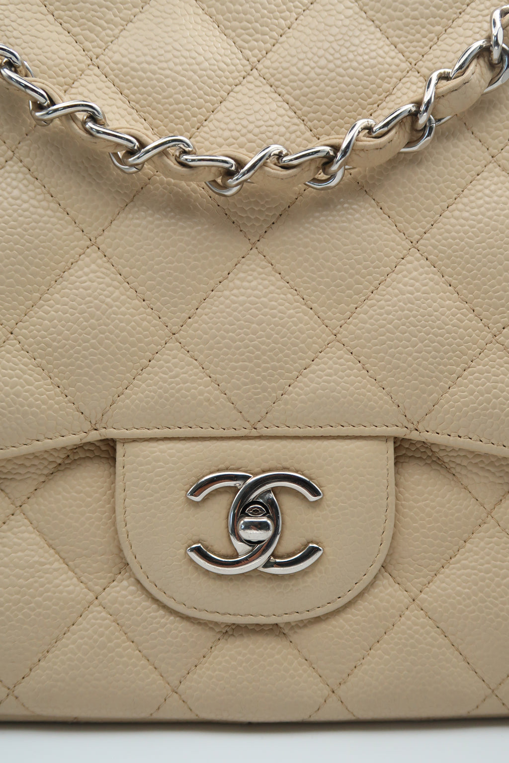 detailed view of Chanel Classic Jumbo in beige caviar