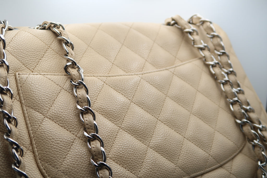 close-up of Chanel Classic Jumbo in beige caviar