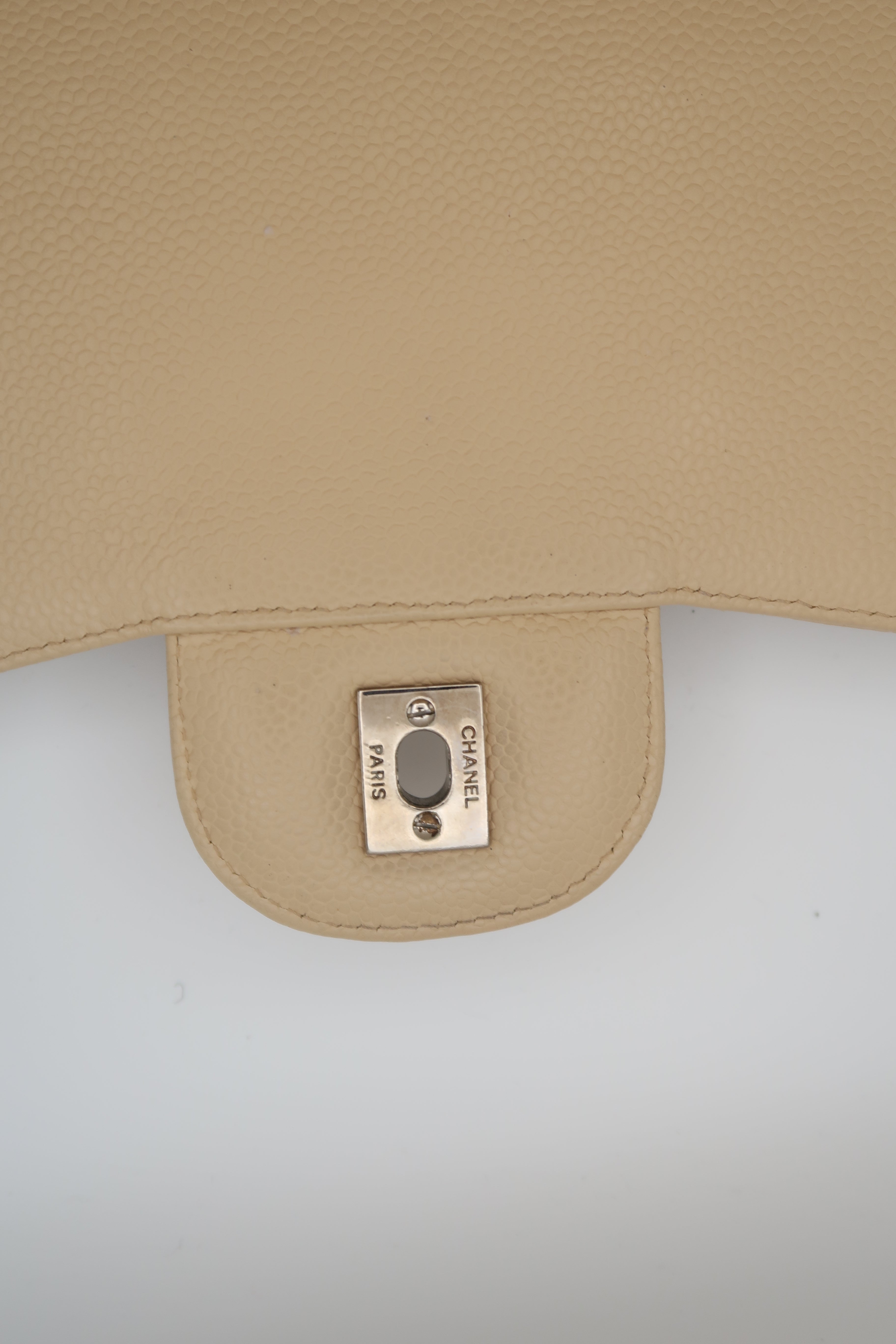 hardware on Chanel Classic Jumbo in beige caviar
