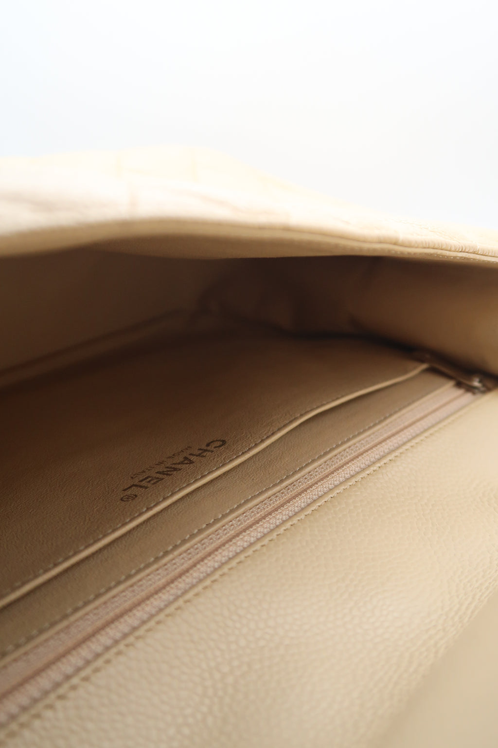 Interior of Chanel Classic Jumbo in beige caviar