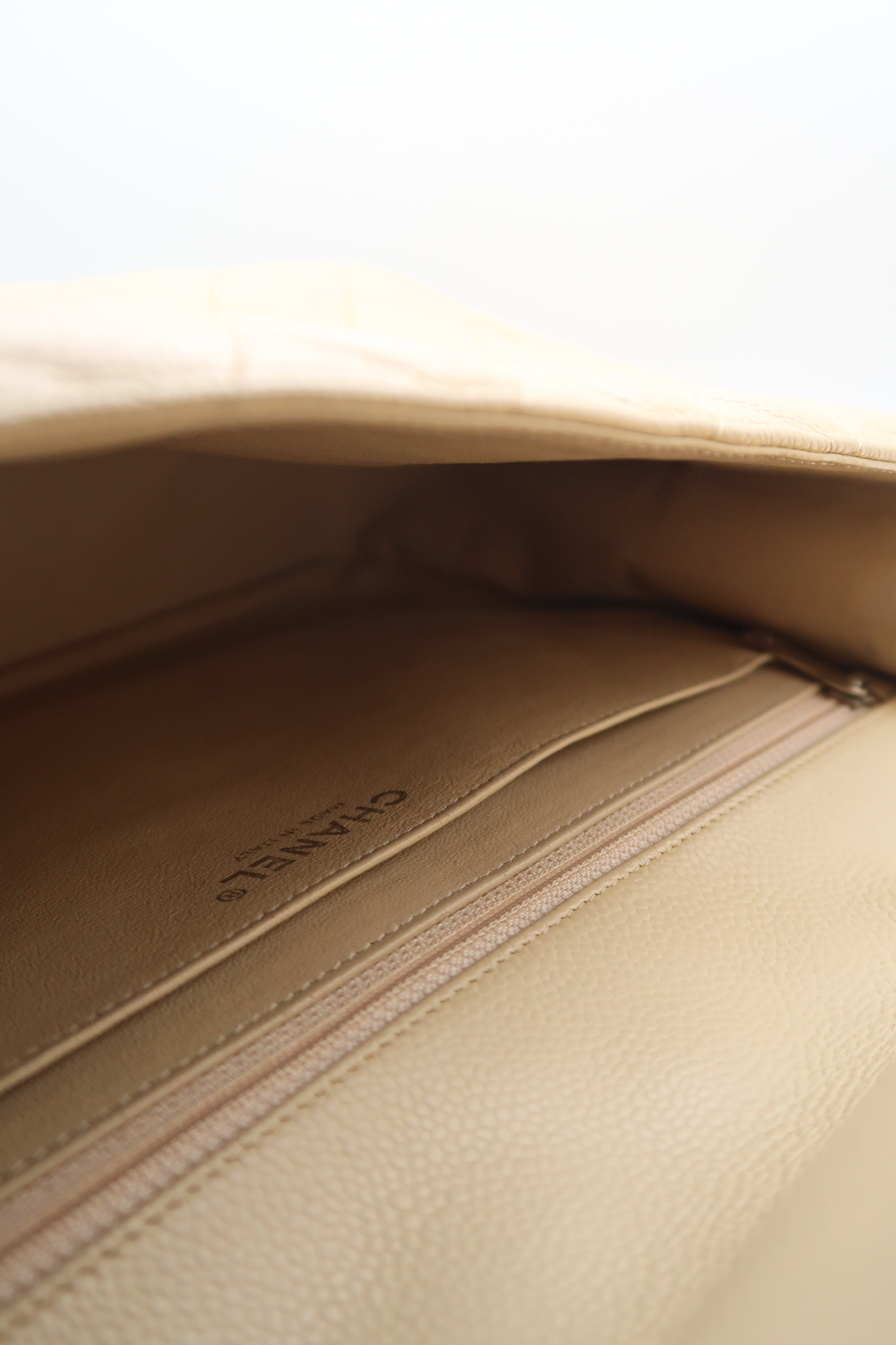 Interior of Chanel Classic Jumbo in beige caviar